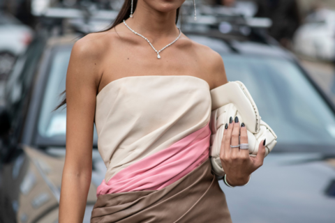 woman holding toiletry bag, travel toiletry bags